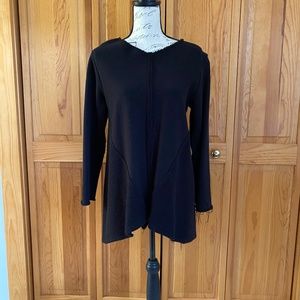 Casual black long top with raw edge detail.